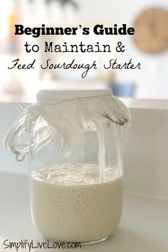 a glass jar filled with liquid sitting on top of a counter