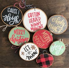 six christmas ornaments with handwritten words on them, including one for each ornament