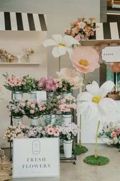 flower shop display with fresh flowers in buckets