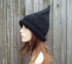 "Knitting Pattern: Witch Hat Finished Measurements: Circumference at brim band 19\" (48 cm) unstretched, 14\" (36 cm) in length from unrolled brim edge to tip of crown; will fit head circumference of 20\" - 23\" (50.5 cm - 58 cm) Yarn: 75 yds (69 m) super bulky weight #6 yarn (shown knitted in Lion Brand Wool Ease Thick and Quick) Needles and Other Materials One 16\" (40.5 cm) circular knitting needle size US 13 (9 mm) or size needed to obtain gauge US 13 (9 mm) set of 5 double-pointed needles o Hat Halloween Costume, Black Witch Hat, Halloween Hat, Wizard Hat, Crochet Santa, Gnome Hat, Chunky Knit Hat, Mens Hat, Pixie Hat