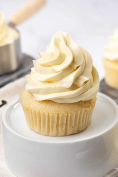 a cupcake sitting on top of a white plate