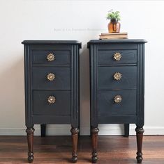 two black nightstands side by side on wooden floors