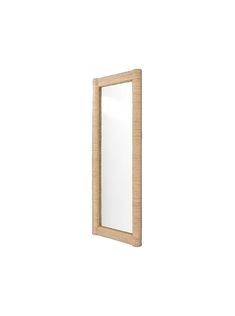 a mirror that is on the wall with a light wood frame and wooden trim around it