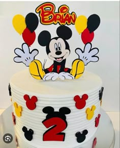 a mickey mouse birthday cake with the number two on it