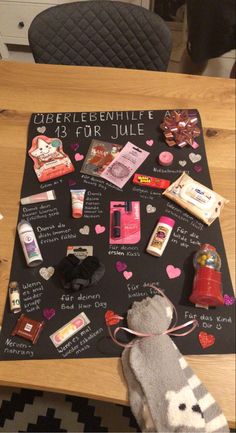 a wooden table topped with lots of different types of items on it's surface