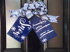 a door hanger that says welcome winter and has snowflakes on the front