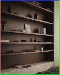 a book shelf filled with books and vases