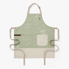 the apron is green and has two pockets