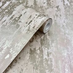 an old, dirty wallpaper with white paint on it's surface is shown