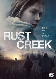 the movie rust creek is shown with two people walking in front of an open field