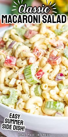 a close up of a bowl of macaroni salad on a table with the words classic macaroni salad