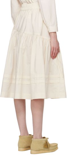 Unbleached organic cotton poplin skirt. · Elasticized waistband · Asymmetric gathered seam · Flared hem · Seam pockets Supplier color: Ecru Cotton Tiered Skirt With Pleated Waist, Cream Cotton Ruffled Skirt, Cream Cotton Flared Skirt, Beige Cotton Gathered Skirt, Cream Full Cotton Skirt, Cream Cotton Full Skirt, Cream Cotton Relaxed Skirt, Cream Cotton Midi Skirt, Relaxed Cream Cotton Skirt