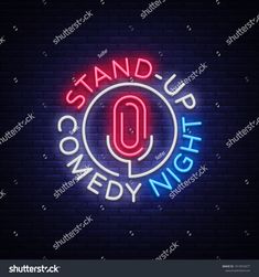 the stand up comedy night neon sign on a brick wall, with an o in the center