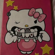 a hello kitty painting on the side of a pink wall with stars around it and a toothbrush in its mouth