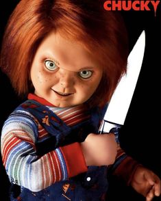 the chucky doll is holding a large knife