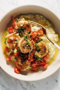 a bowl filled with mashed potatoes and shrimp