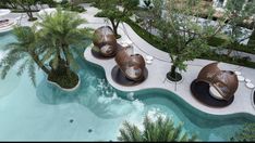 an aerial view of a pool with lounge chairs and palm trees in the foreground