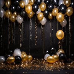 black, white and gold balloons with streamers