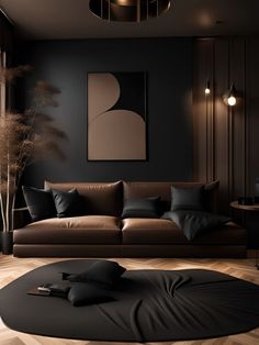 a living room with black walls and brown leather furniture in the center, surrounded by wood flooring