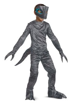 a boy in a costume that looks like an alien is standing with his hands out