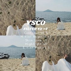 a woman sitting on top of a sandy beach next to the ocean wearing a white dress