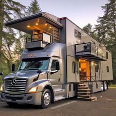 a truck with a house on the back and stairs leading up to it's roof