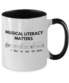 a black and white coffee mug with musical literacy matters written on it