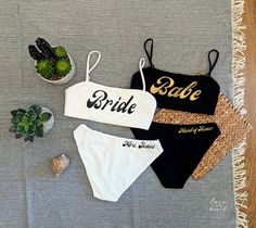 two bathing suits with the bride written on them next to succulents and cacti