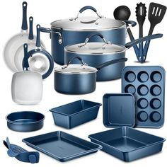 an assortment of blue and white kitchenware including pots, pans, and utensils