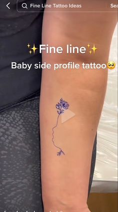 a woman's arm with a tattoo on it that reads fine line baby side profile tattoo