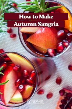 two glasses filled with fruit and garnish on top of a table