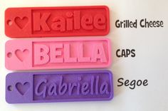 three name tags with hearts and the words kalie, bella, gabrilla