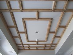 the ceiling in this room is made out of wood and has white paint on it