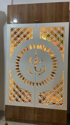 an intricately designed glass door with the symbol omg