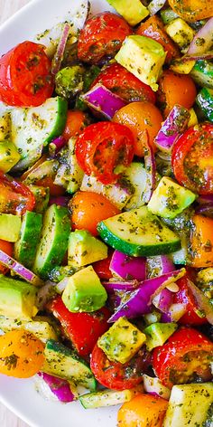 a white plate topped with lots of veggies