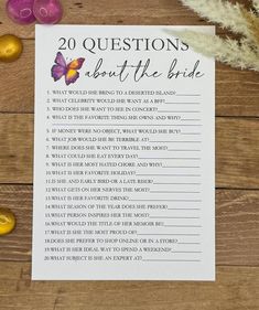 a printable 20 questions about the bride on a wooden table with flowers and candles