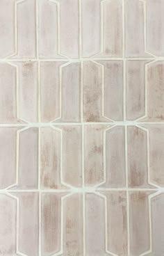 an image of a white tile pattern that looks like it has been painted in different colors