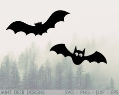 two bats flying in the air over trees