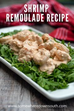 Close up photo of shrimp coated in remoulade sauce on green arugula. The salad is on a rectangular white dish and you can see a red dishtowel in the background. The title reads Shrimp remoulade salad. Shrimp Roumalade Sauce, Shrimp Roumalade Salad, Shrimp Romalaud, Shrimp Remoulade Sauce, Shrimp Remoulade Salad, Crawfish Salad Recipes, Leftover Shrimp Cocktail Recipes, Cajun Shrimp Salad, New Orleans Style Shrimp