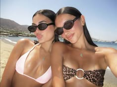 two beautiful young women in bikinis on the beach