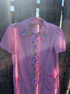 Such a great piece to have! This can be worn many ways! You can wear it around the house while making breakfast on a casual day. Or it can be worn with a tank and jeans, worn open. Cute print, light cotton candy pink. This is from the 1960's and does have a few imperfections, a tiny hole on the front right. Cute bright embroidery Pink Collared Tops For Spring, Pink Tops For Summer Daywear, Pink Tops For Daywear In Summer, Pink Summer Tops For Daywear, Pink Summer Top For Daywear, Summer Pink Top For Daywear, Pink Collared Tops For Daywear, Vintage Summer Tops For Picnics, Vintage Tops For Summer Picnics