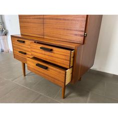 a large wooden dresser with two drawers