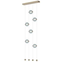 a light fixture with five balls hanging from it's sides and four lights on each side