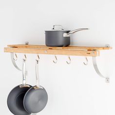 pots and pans are hanging on the wall