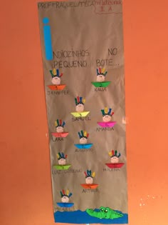 a paper bag with pictures of people on it hanging from the side of a wall