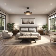 a large bedroom with wooden floors and white furniture in front of two windows that look out onto the woods