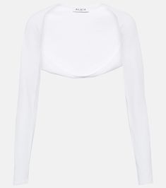 Knit Shrug in White - Alaia | Mytheresa White Evening Crop Top, Elegant White Stretch Crop Top, White Chic Fitted Shrug, Elegant White Open Front Top, Elegant Ribbed Cropped Crop Top, Elegant Fitted Ribbed Crop Top, White Shrug For Spring Layering, White Cropped Tops For Evening, White Stretch Long Sleeve Shrug