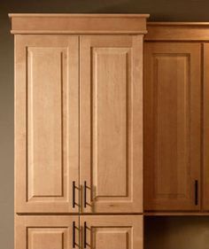 a kitchen with wooden cabinets in it