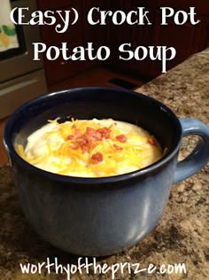 an easy crock pot potato soup in a blue bowl on a granite countertop