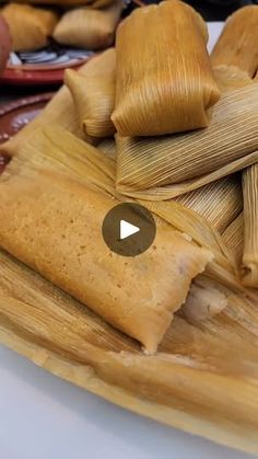 tamales are stacked on top of each other and ready to be cooked in the oven